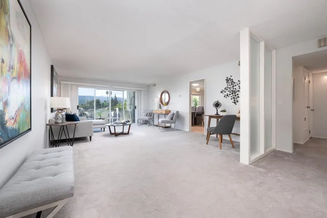 a living room with furniture and a table