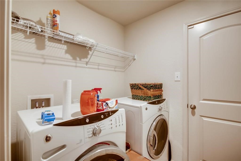 20029 Grover Cleveland Way Manor, TX 78653 - Photo 7 of 8 a utility room with dryer and washer