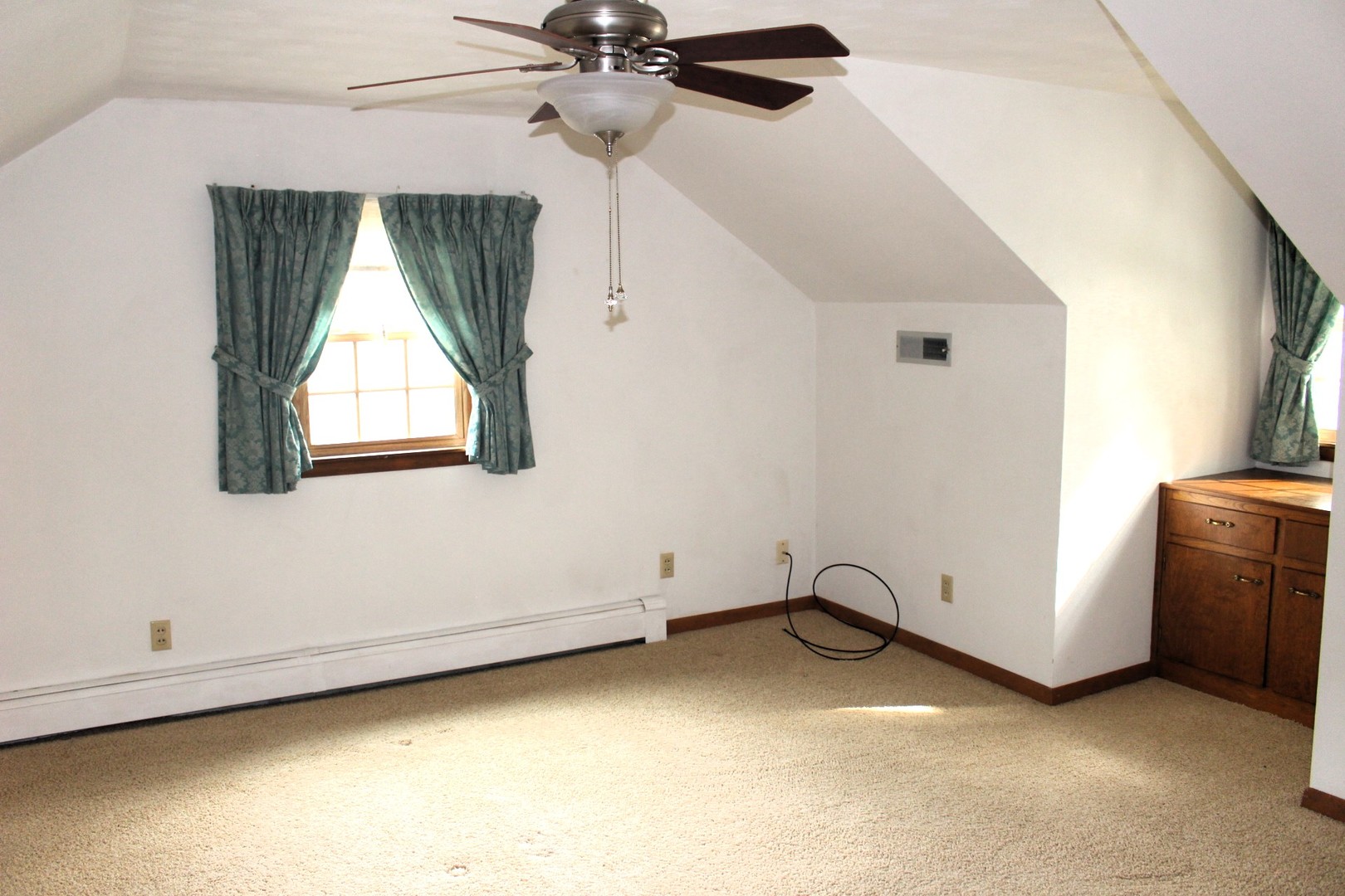 55 Hillcrest Drive Clinton, IL 61727 - Photo 12 of 22 an empty room with windows and fan