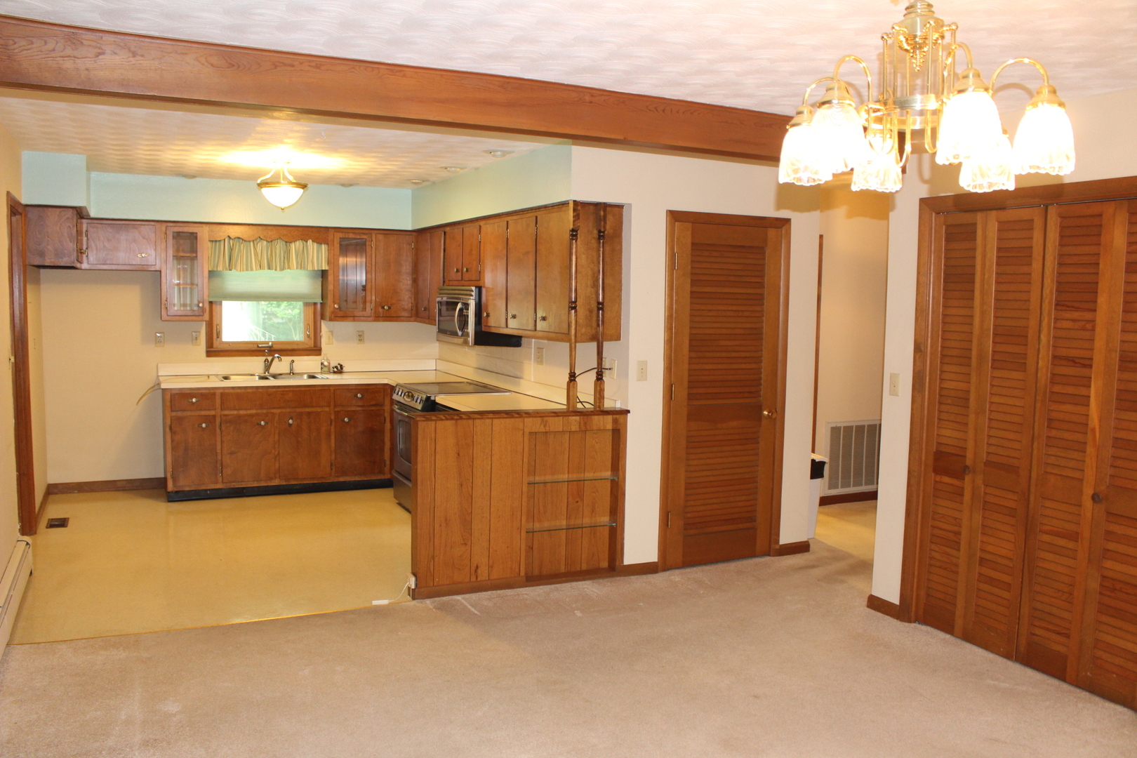 55 Hillcrest Drive Clinton, IL 61727 - Photo 7 of 22 a kitchen with stainless steel appliances granite countertop a refrigerator a sink and a stove