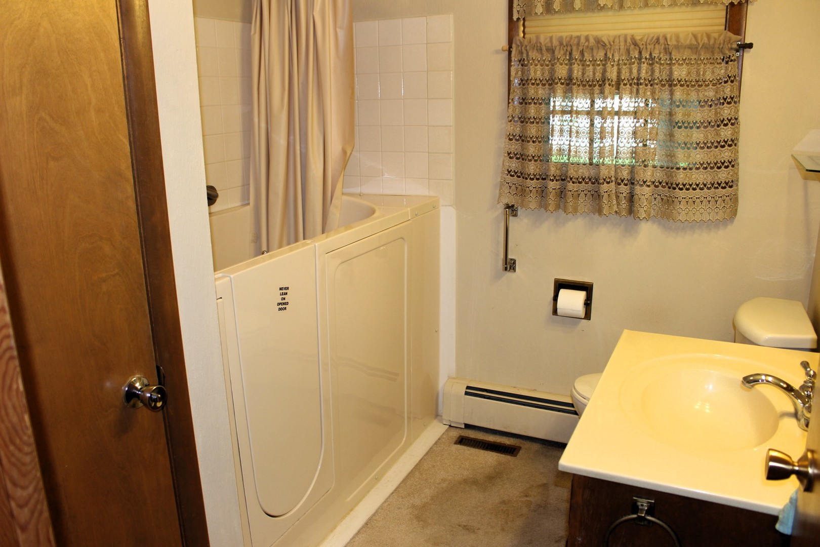 55 Hillcrest Drive Clinton, IL 61727 - Photo 9 of 22 a bathroom with a sink and a mirror