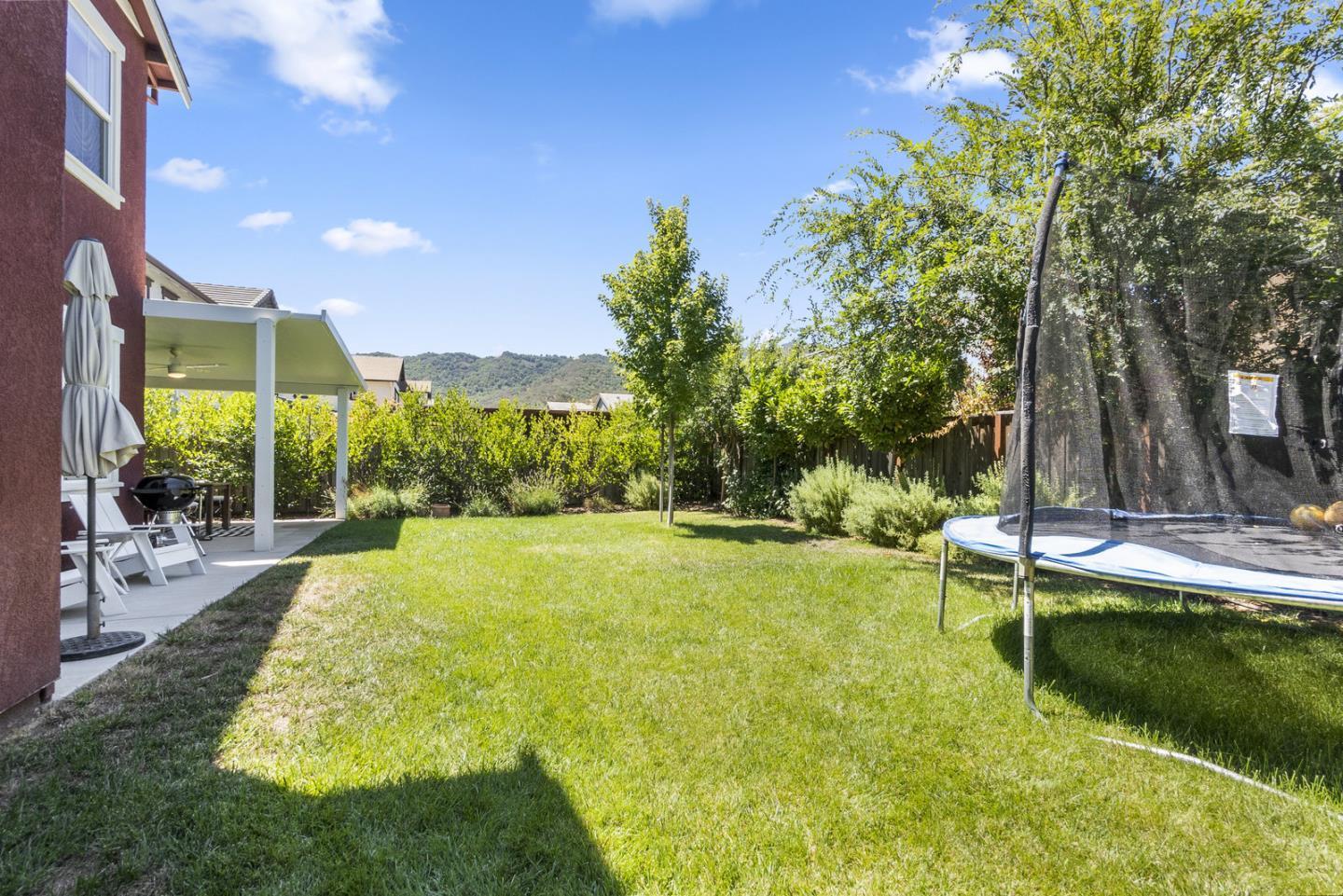 1237 Viognier Way Gilroy, CA 95020 - Photo 11 of 47 a swimming pool with outdoor seating and yard