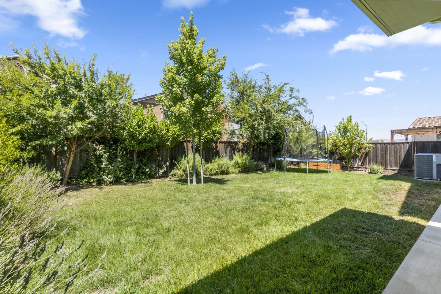 1237 Viognier Way Gilroy, CA 95020 - Photo 12 of 47 a view of a backyard with a garden