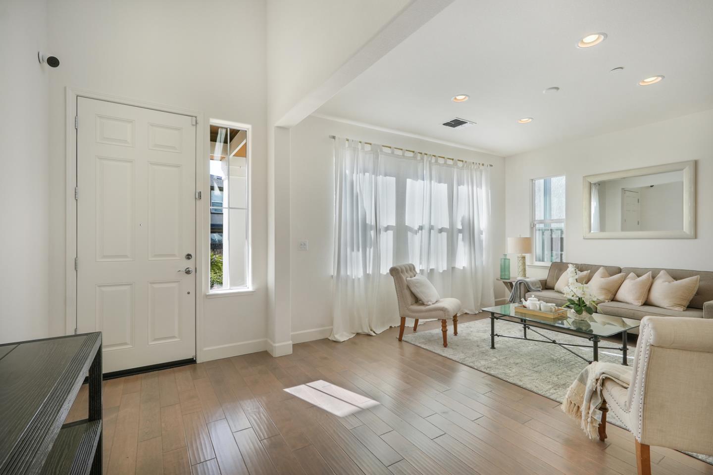 1237 Viognier Way Gilroy, CA 95020 - Photo 15 of 47 a living room with furniture and two window