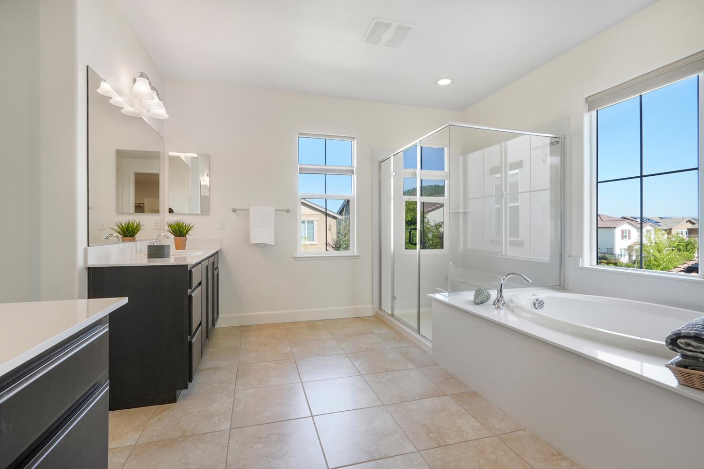 1237 Viognier Way Gilroy, CA 95020 - Photo 33 of 47 a spacious bathroom with a double vanity sink a mirror and a bathtub