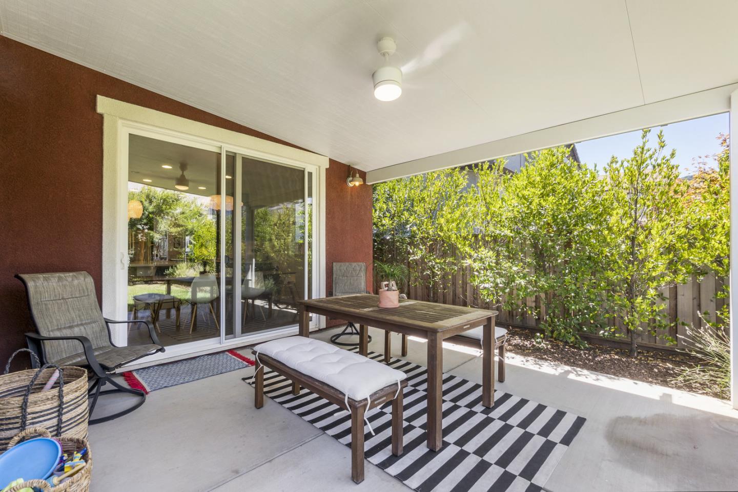 1237 Viognier Way Gilroy, CA 95020 - Photo 10 of 47 a view of a patio with table and chairs with wooden floor and fence