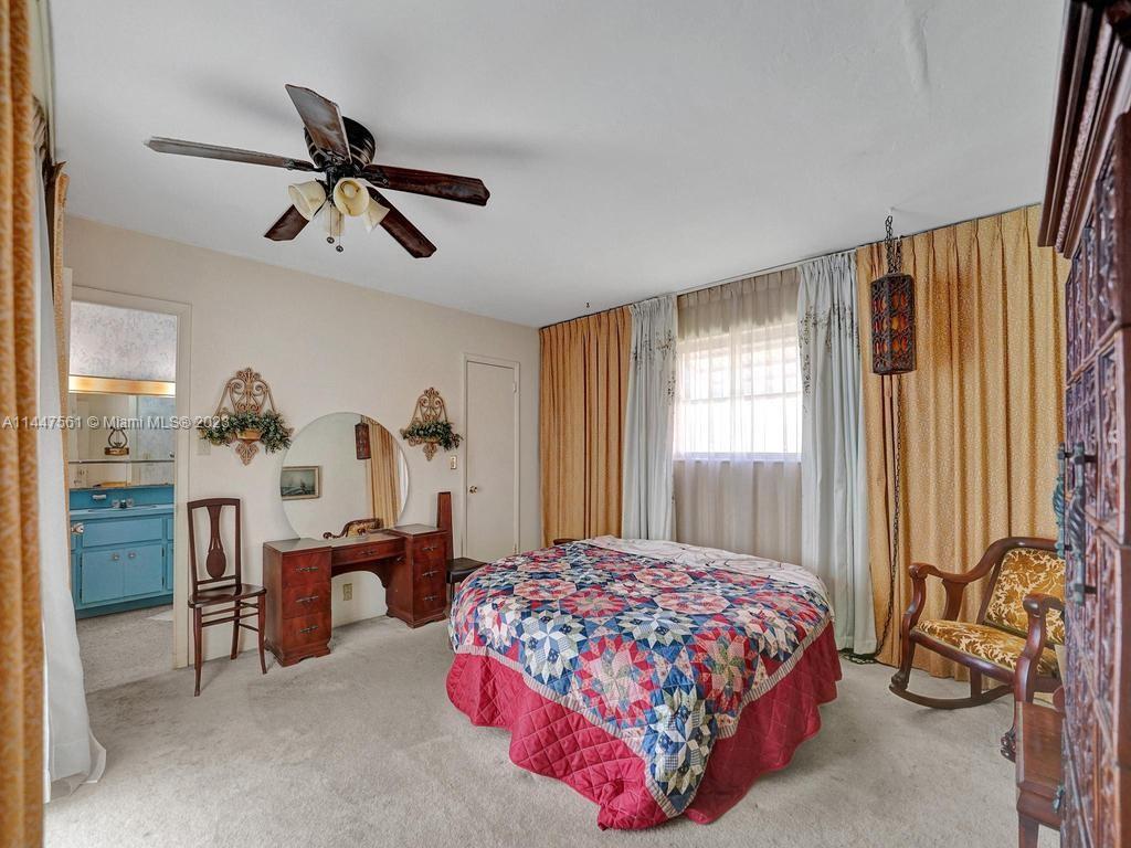 5525 Jackson Street Hollywood, FL 33021 - Photo 14 of 91 a bedroom with a bed furniture and a window