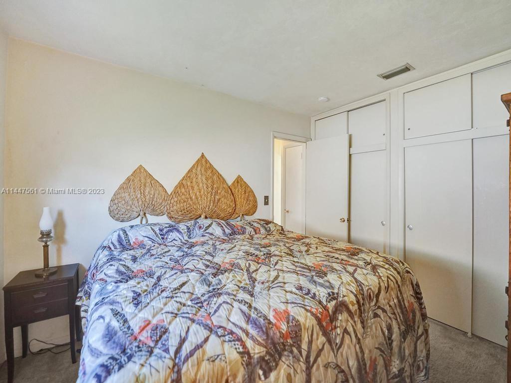 5525 Jackson Street Hollywood, FL 33021 - Photo 23 of 91 a bedroom with a bed and a window