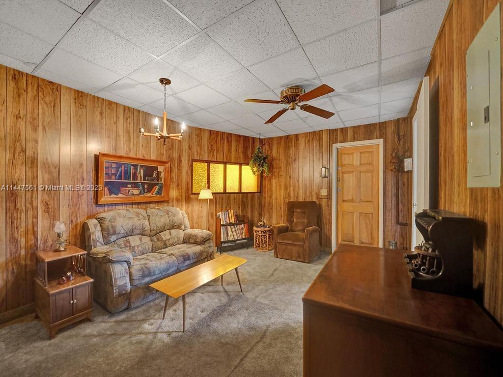 5525 Jackson Street Hollywood, FL 33021 - Photo 36 of 91 a living room with furniture and a large window