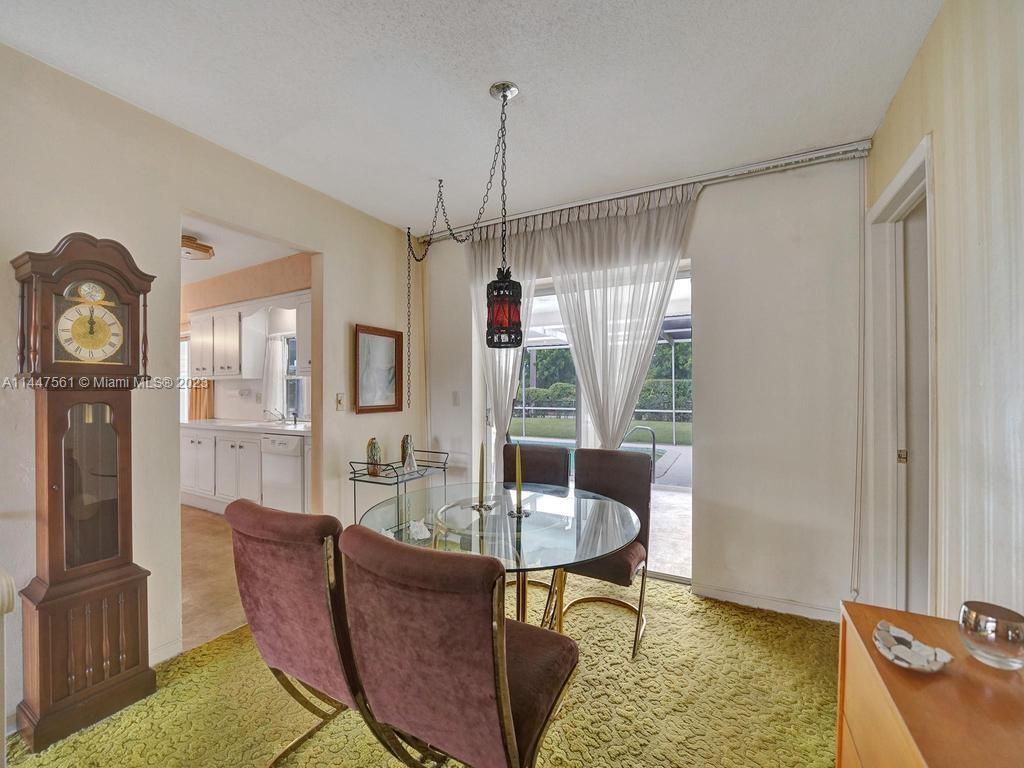 5525 Jackson Street Hollywood, FL 33021 - Photo 48 of 91 a dining room with furniture and window