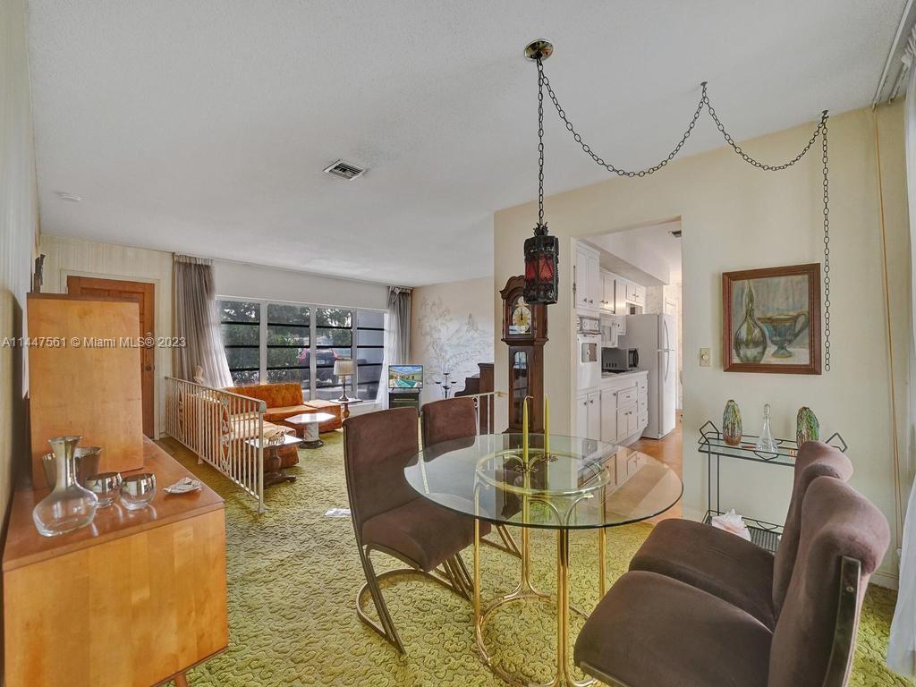 5525 Jackson Street Hollywood, FL 33021 - Photo 49 of 91 a view of a dining room with furniture window and outside view