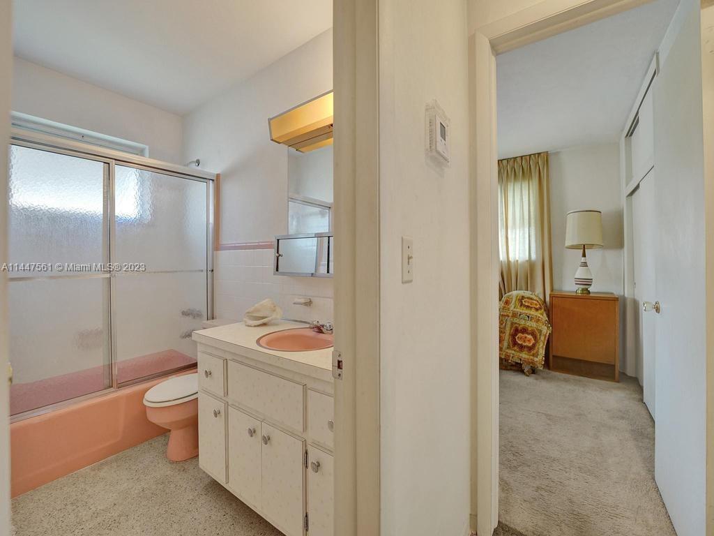 5525 Jackson Street Hollywood, FL 33021 - Photo 54 of 91 a bathroom with a sink a toilet and shower