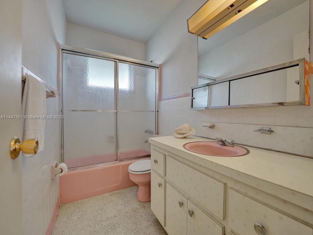 5525 Jackson Street Hollywood, FL 33021 - Photo 55 of 91 a bathroom with a sink a toilet and shower