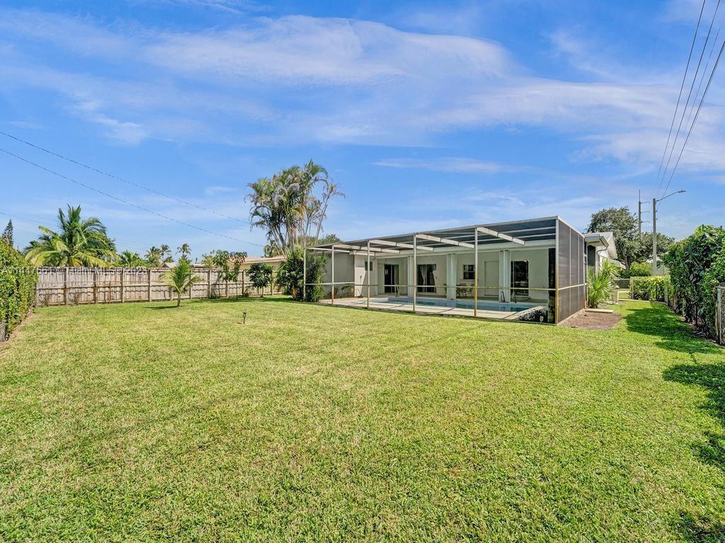 5525 Jackson Street Hollywood, FL 33021 - Photo 70 of 91 a front view of a house with a big yard