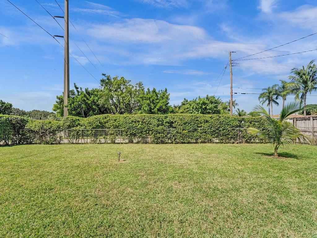 5525 Jackson Street Hollywood, FL 33021 - Photo 74 of 91 a view of a big yard with potted plants