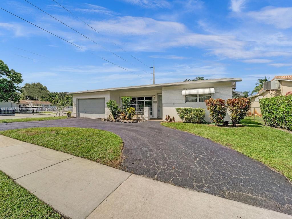 5525 Jackson Street Hollywood, FL 33021 - Photo 79 of 91 a view of a house with a garden