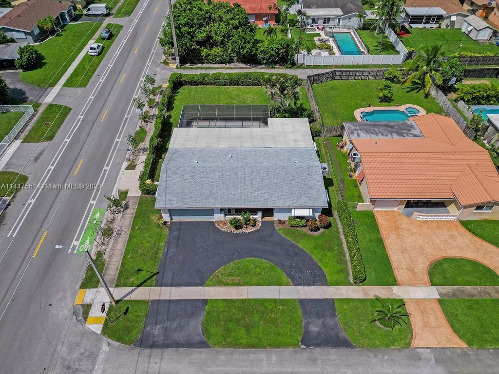 5525 Jackson Street Hollywood, FL 33021 - Photo 85 of 91 an aerial view of a house with a garden and swimming pool