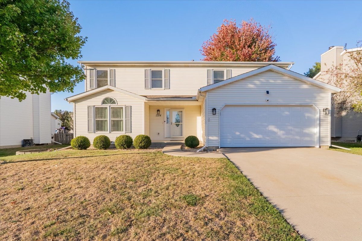1314 Lismore Lane Normal, IL 61761 - Photo 1 of 26 a front view of a house with a yard