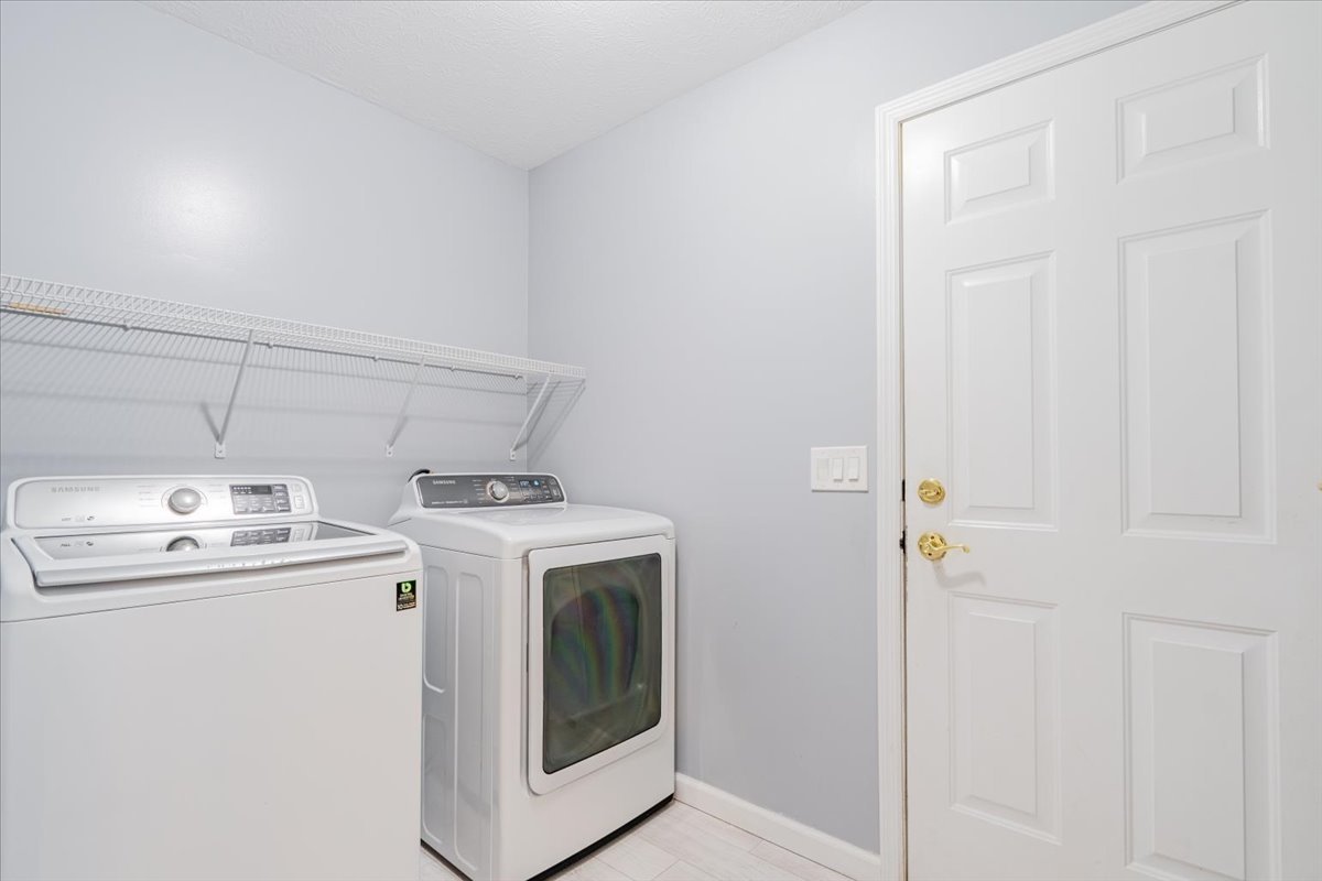 1314 Lismore Lane Normal, IL 61761 - Photo 12 of 26 a utility room with dryer and washer