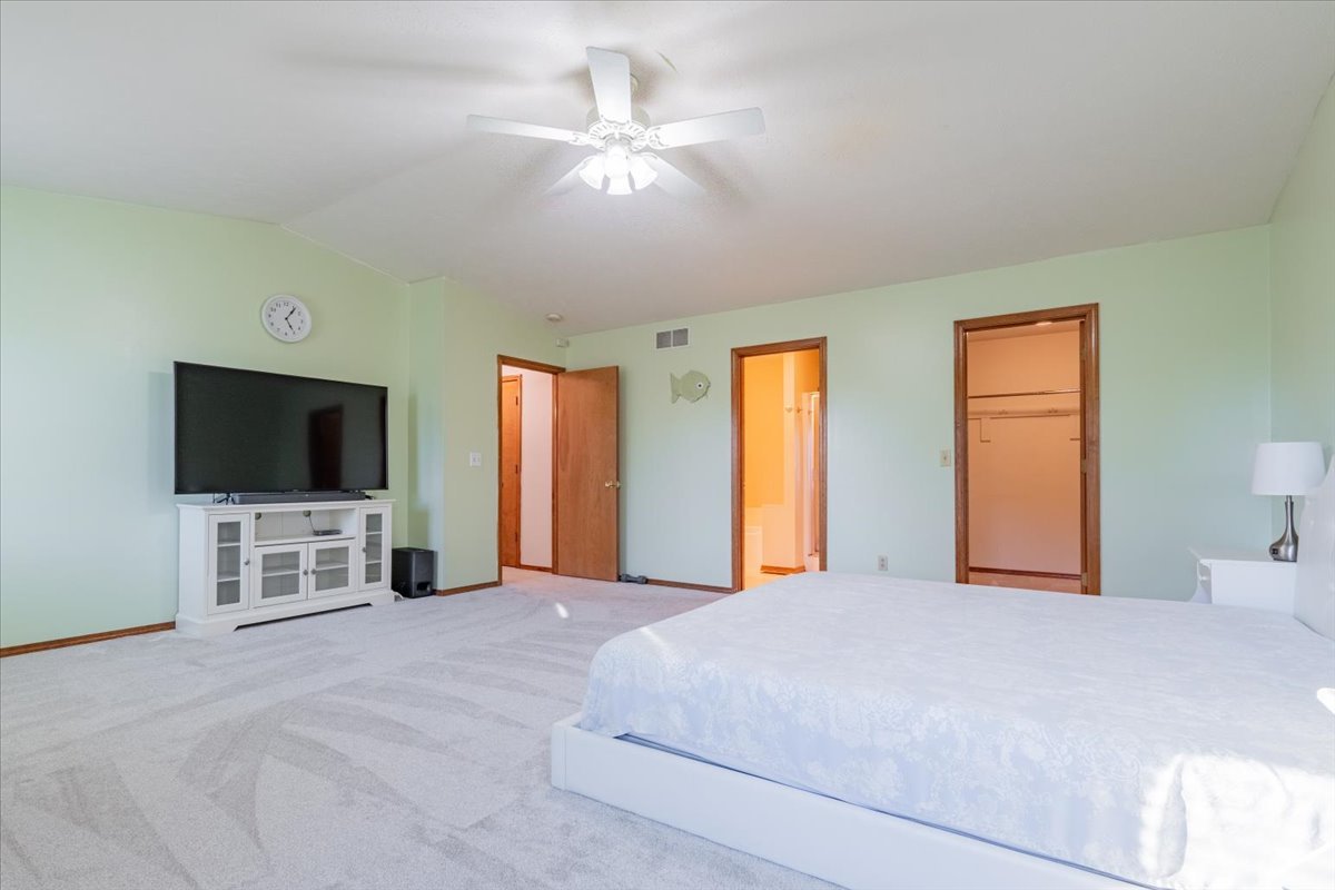 1314 Lismore Lane Normal, IL 61761 - Photo 13 of 26 a bedroom with a bed and a flat screen tv