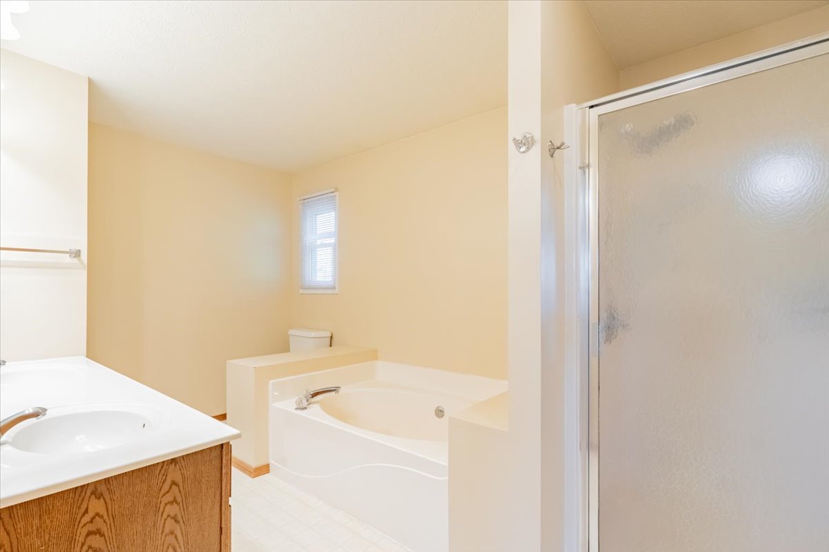 1314 Lismore Lane Normal, IL 61761 - Photo 15 of 26 a bathroom with a sink a toilet and shower