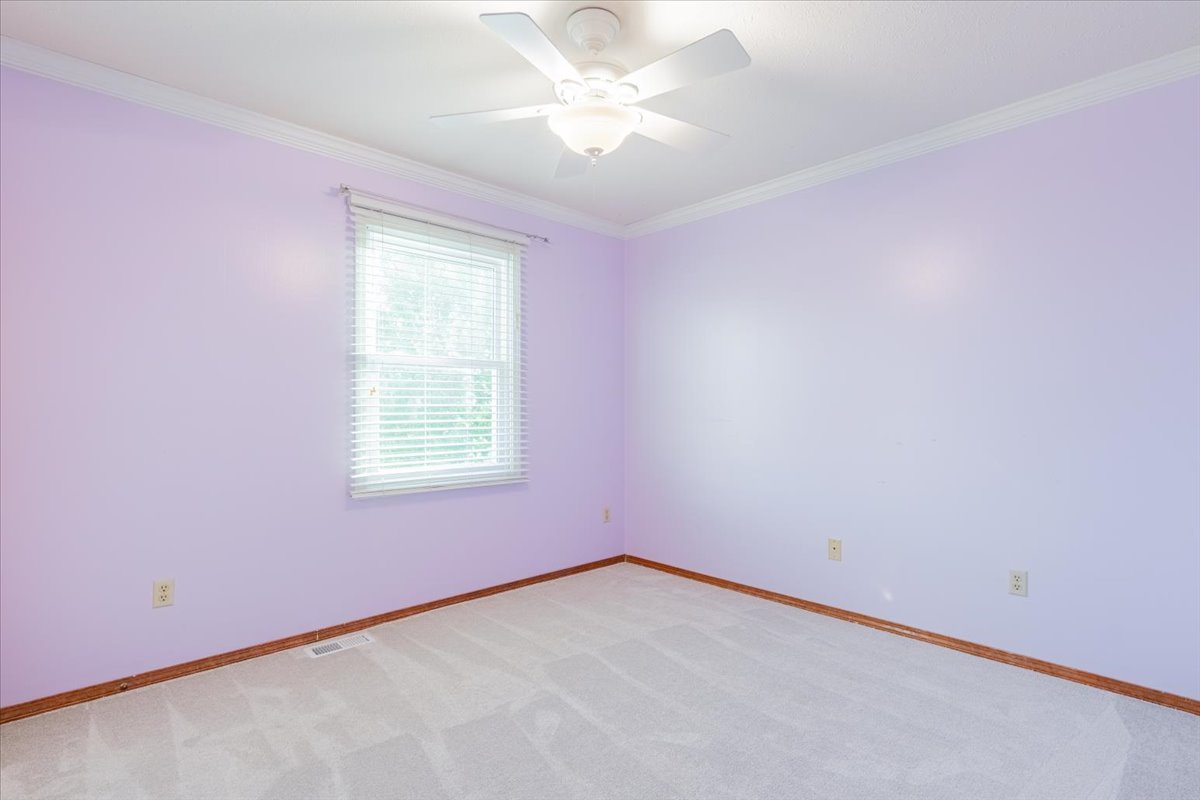 1314 Lismore Lane Normal, IL 61761 - Photo 16 of 26 an empty room with a window and a fan