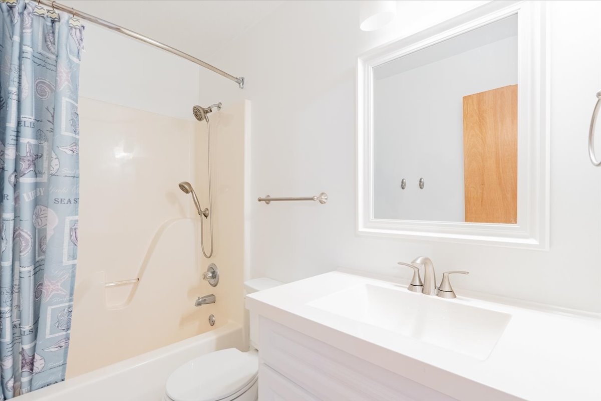 1314 Lismore Lane Normal, IL 61761 - Photo 18 of 26 a bathroom with a granite countertop sink toilet and shower