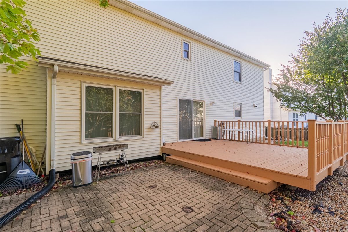 1314 Lismore Lane Normal, IL 61761 - Photo 22 of 26 a view of a white house with a wooden fence