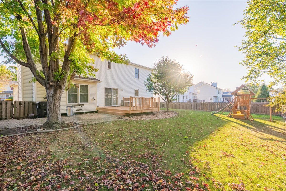 1314 Lismore Lane Normal, IL 61761 - Photo 23 of 26 a house with trees in front of it