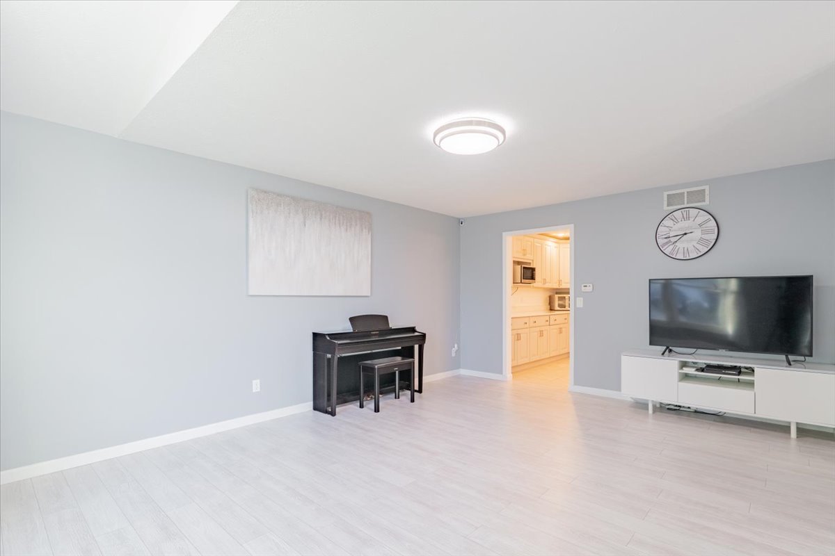1314 Lismore Lane Normal, IL 61761 - Photo 4 of 26 a view of room with wooden floor and windows
