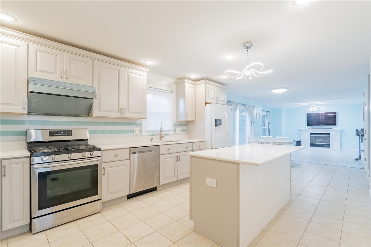 1314 Lismore Lane Normal, IL 61761 - Photo 5 of 26 a kitchen with a stove top oven and cabinets