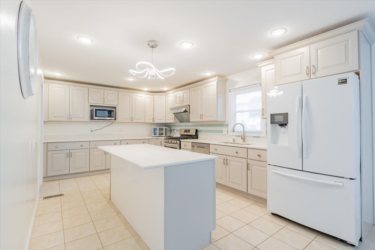 1314 Lismore Lane Normal, IL 61761 - Photo 7 of 26 a kitchen with white cabinets and white appliances