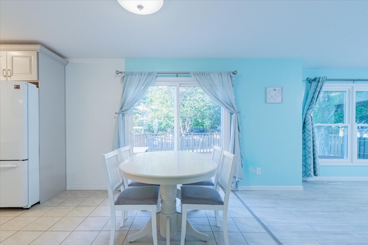 1314 Lismore Lane Normal, IL 61761 - Photo 8 of 26 a dining room with furniture and window