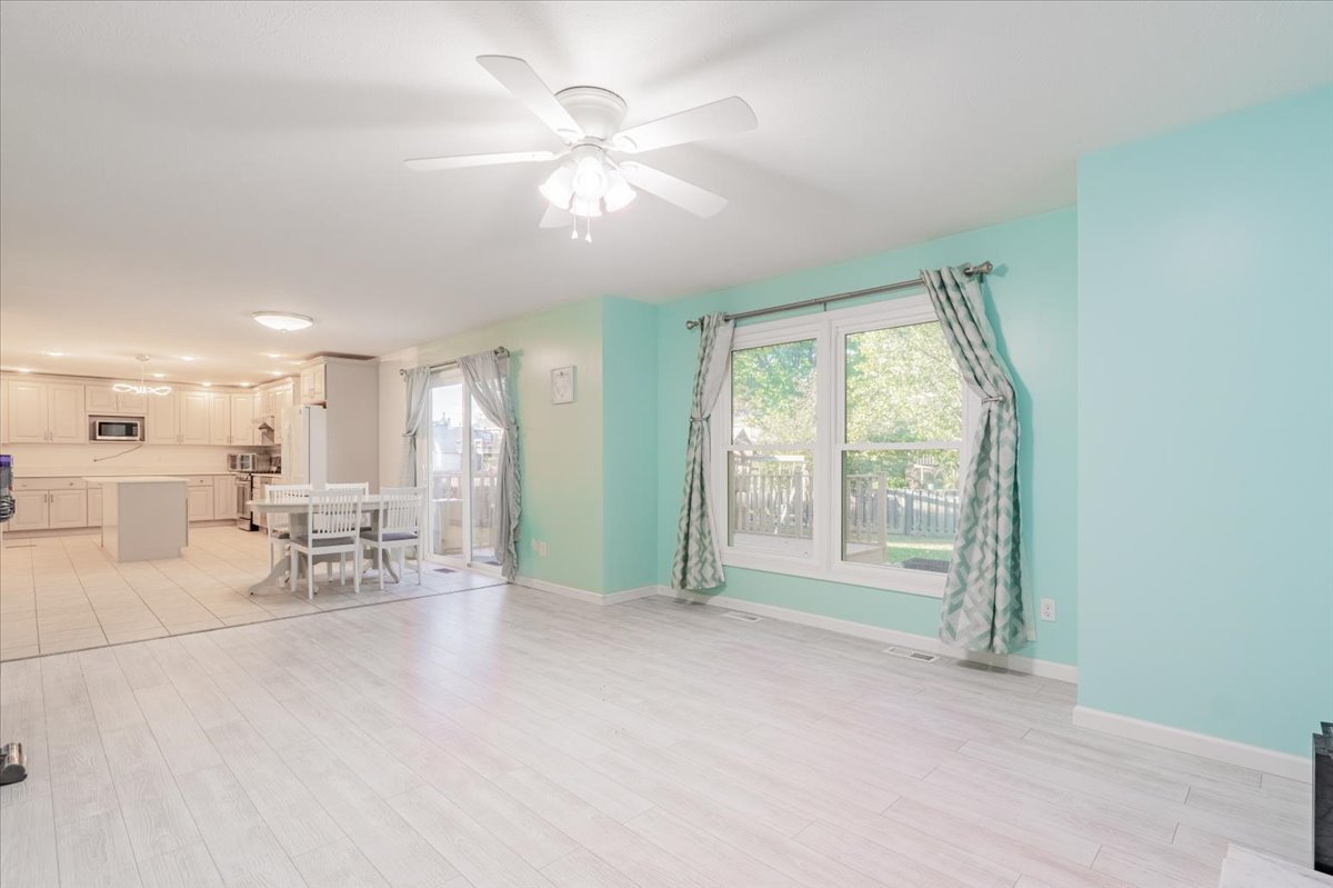 1314 Lismore Lane Normal, IL 61761 - Photo 10 of 26 a view of a livingroom with furniture and a large window
