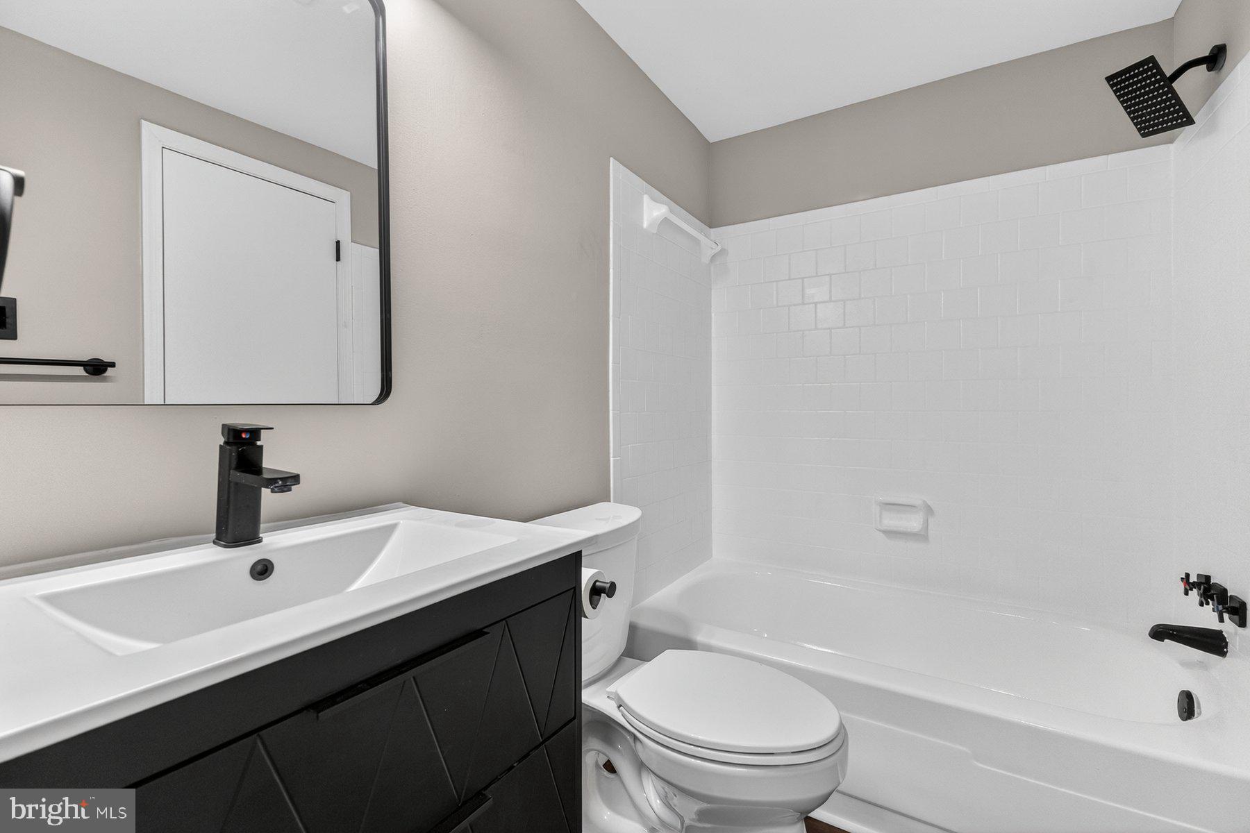 4810 A Wheeler Road Temple Hills, MD 20748 - Photo 19 of 28 Sleek modern bathroom with clean lines.