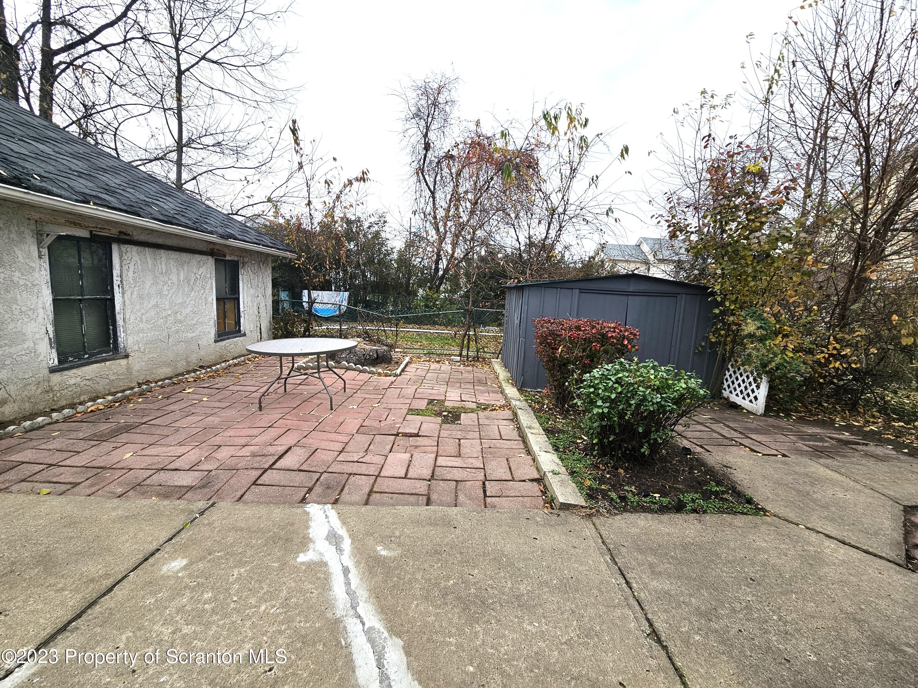 828 Cedar Avenue Scranton, PA 18505 - Photo 13 of 13 a front view of a house with garden