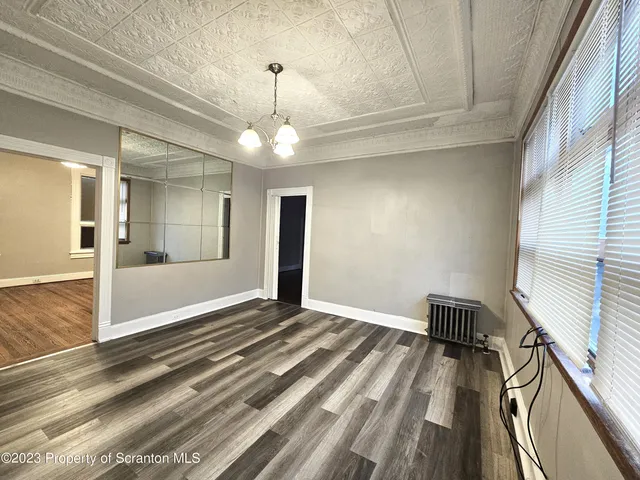 a view of an empty room and glass door