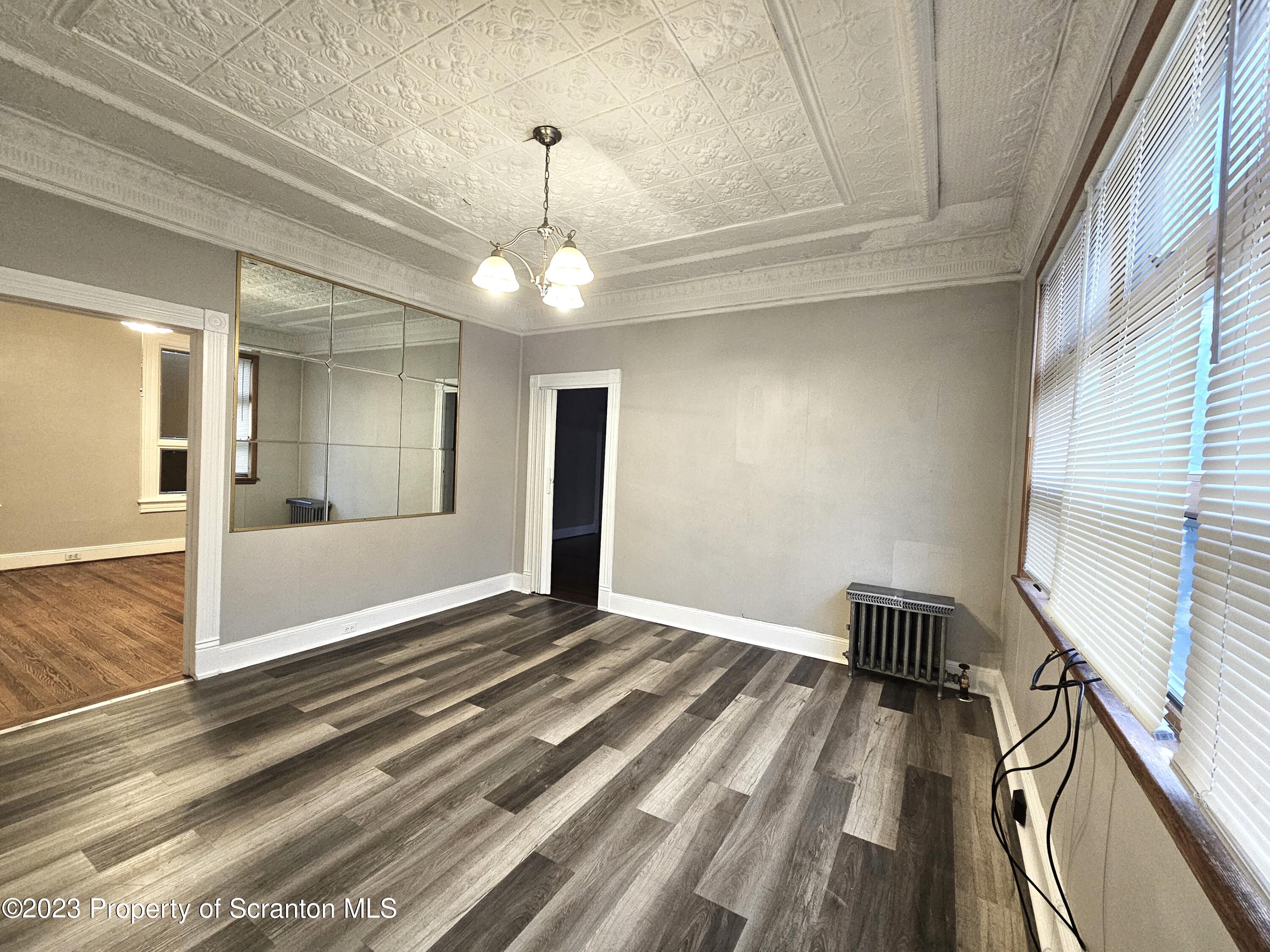 828 Cedar Avenue Scranton, PA 18505 - Photo 10 of 13 a view of an empty room and glass door