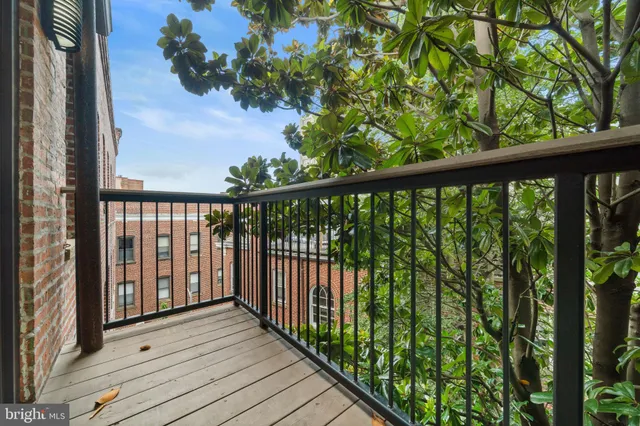 a view of a balcony with wooden floor