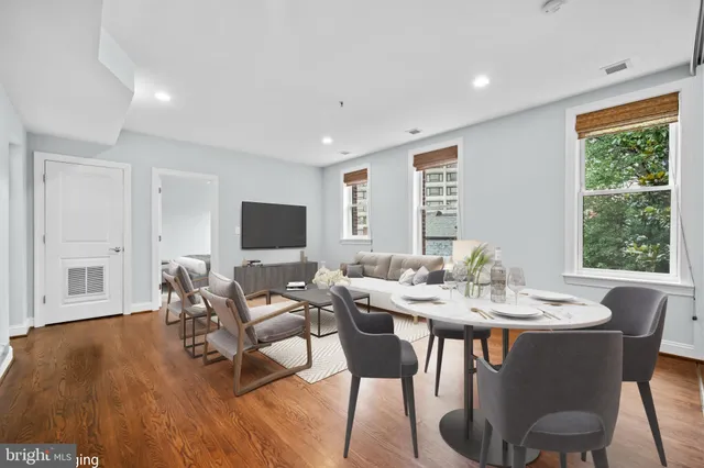 a view of a dining room with furniture window and wooden floor