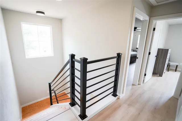 a view of a hallway with stairs