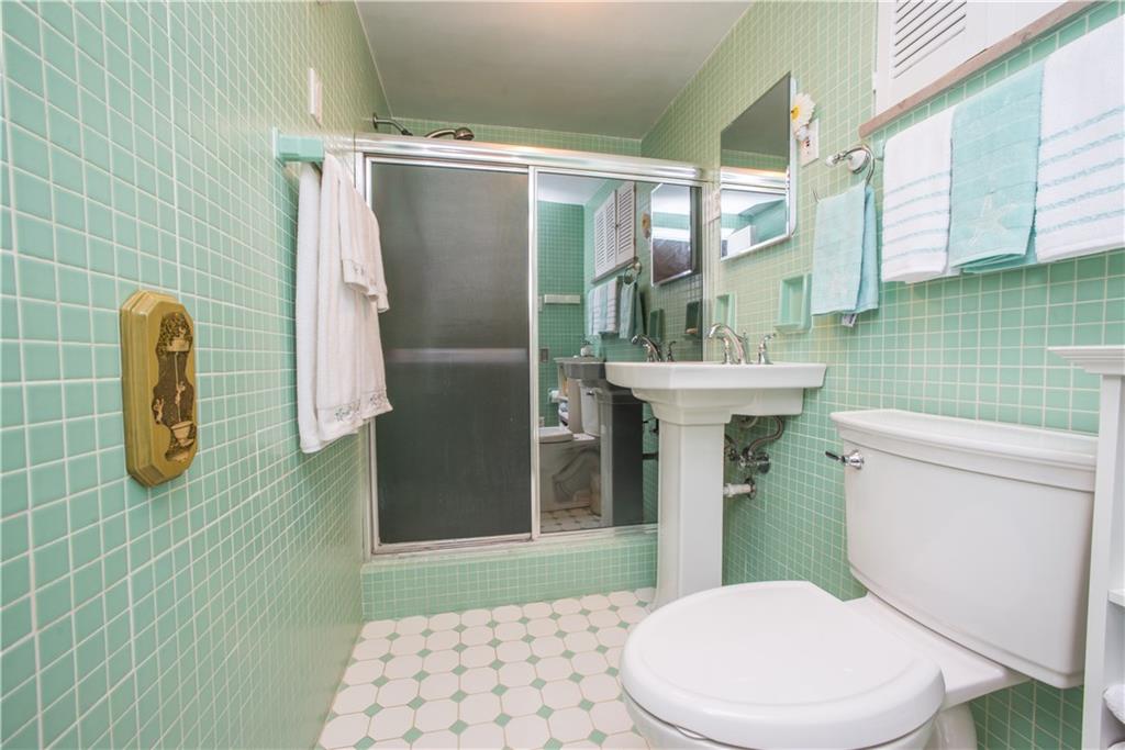 443 North Lewis Run Road West Mifflin, PA 15122 - Photo 19 of 25 The master bath includes impeccably clean tile and a pedestal sink.