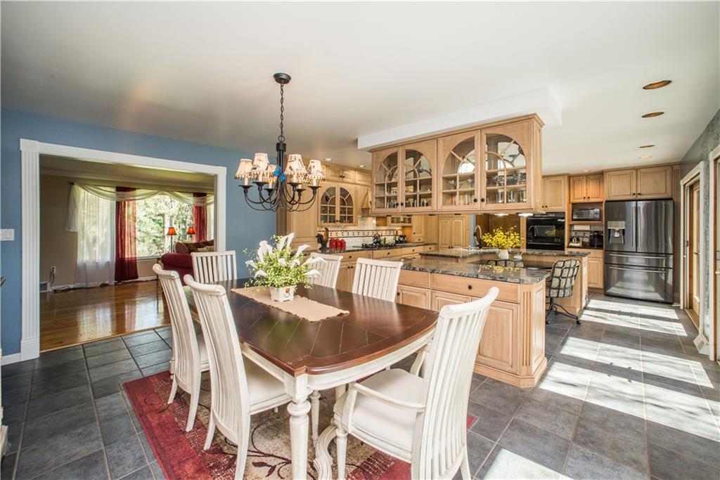 443 North Lewis Run Road West Mifflin, PA 15122 - Photo 9 of 25 Recessed lighting set on a dimmer help to accentuate the custom kitchen.