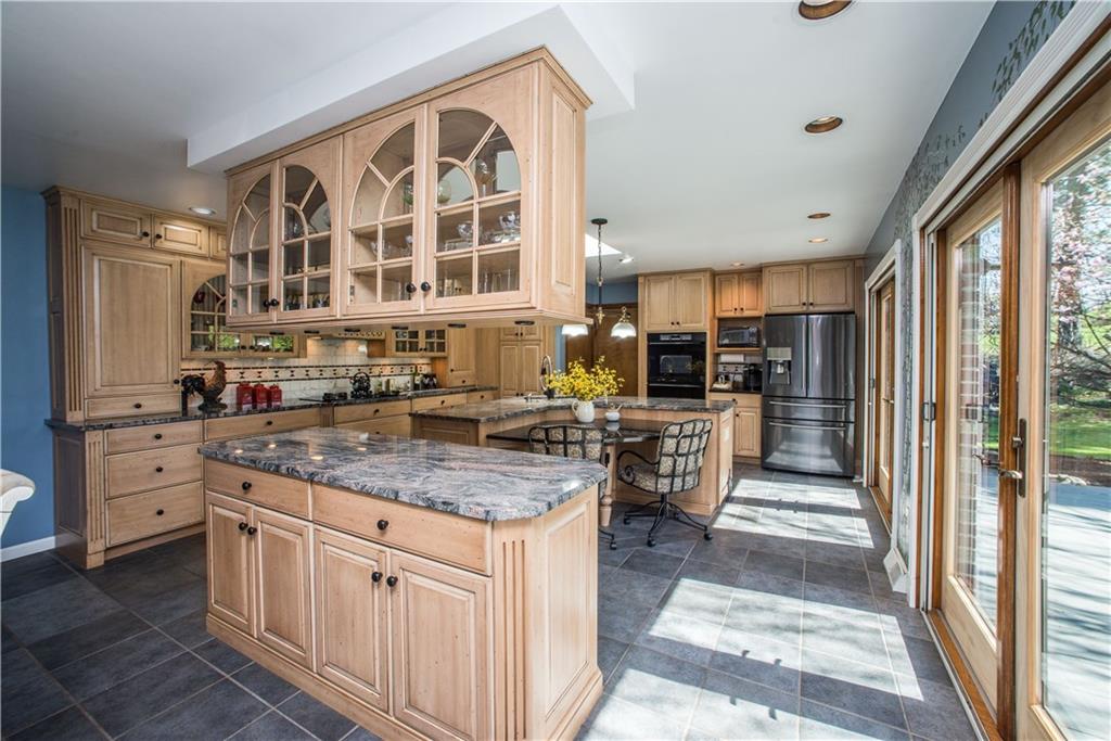 443 North Lewis Run Road West Mifflin, PA 15122 - Photo 10 of 25 The custom kitchen includes two granite islands with custom cabinetry.