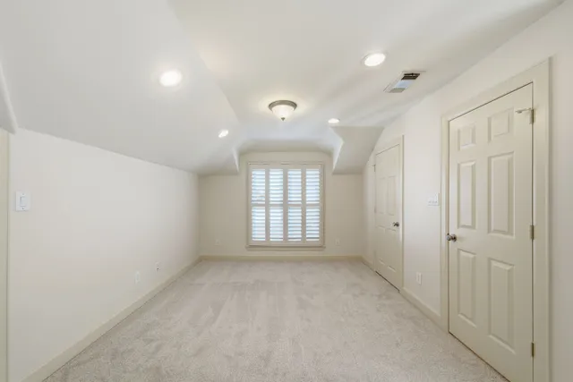 a kitchen with white cabinets and a stove