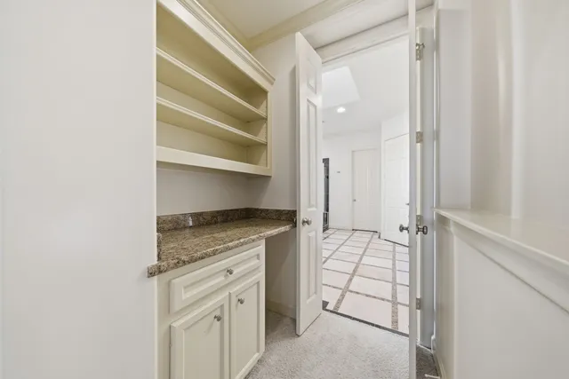 a view of an empty walk in closet