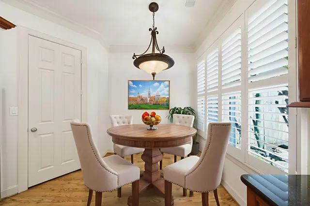 a dining room with furniture and window