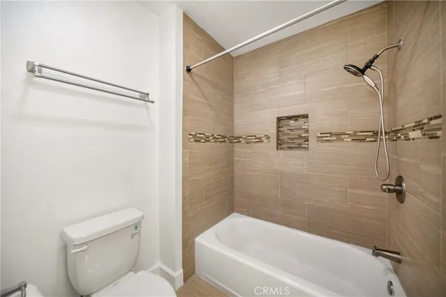 a bathroom with a toilet and shower