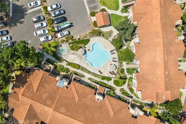 an aerial view of a house with a backyard