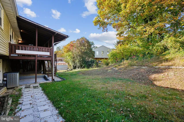 a view of a backyard with sitting area
